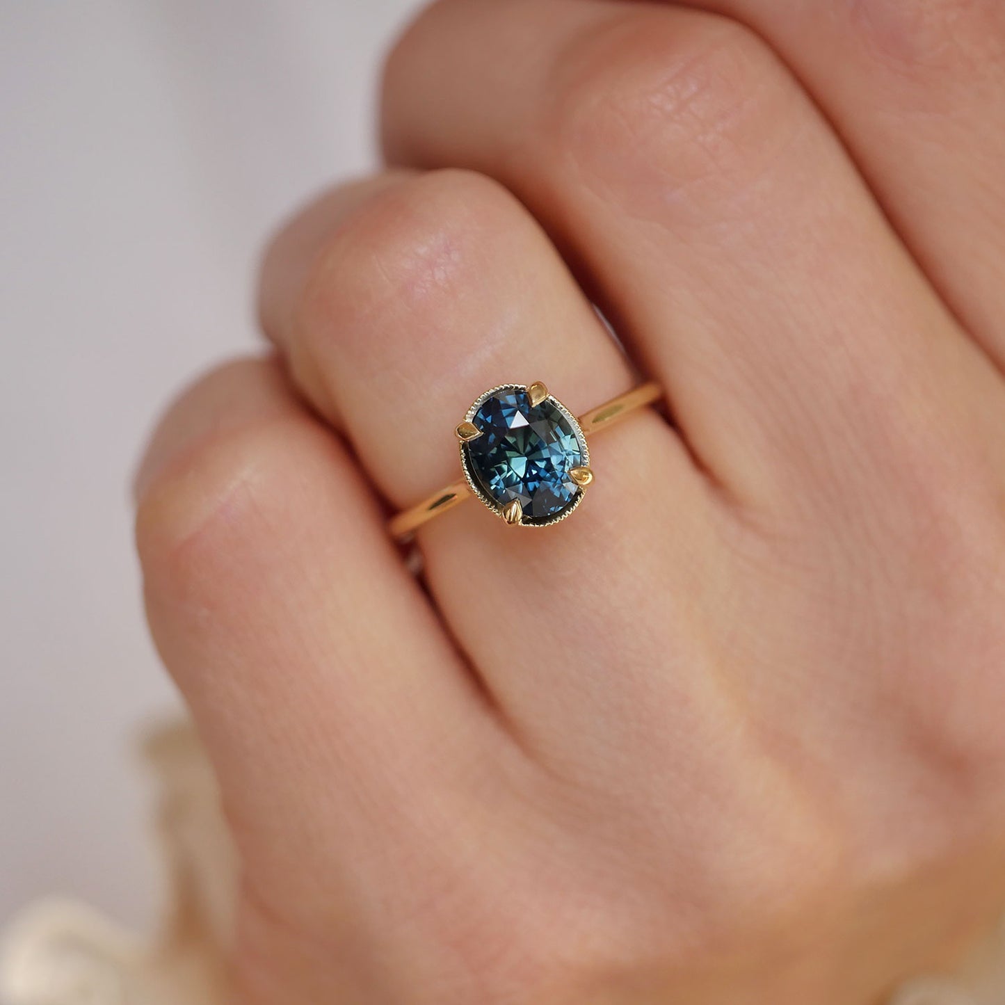 Teal sapphire blue green oval solitaire engagement ring