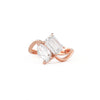 This bypass toi et moi diamond ring features a stunning combination of a pear-shaped and emerald-cut diamond, symbolizing the union of two souls in perfect harmony. Set in rose gold.