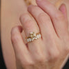 Antique inspired emerald cut diamond solitaire ring with floral inspired diamond stacking band