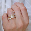 Nature inspired oval engagement ring with confetti diamond mosaic wedding band.