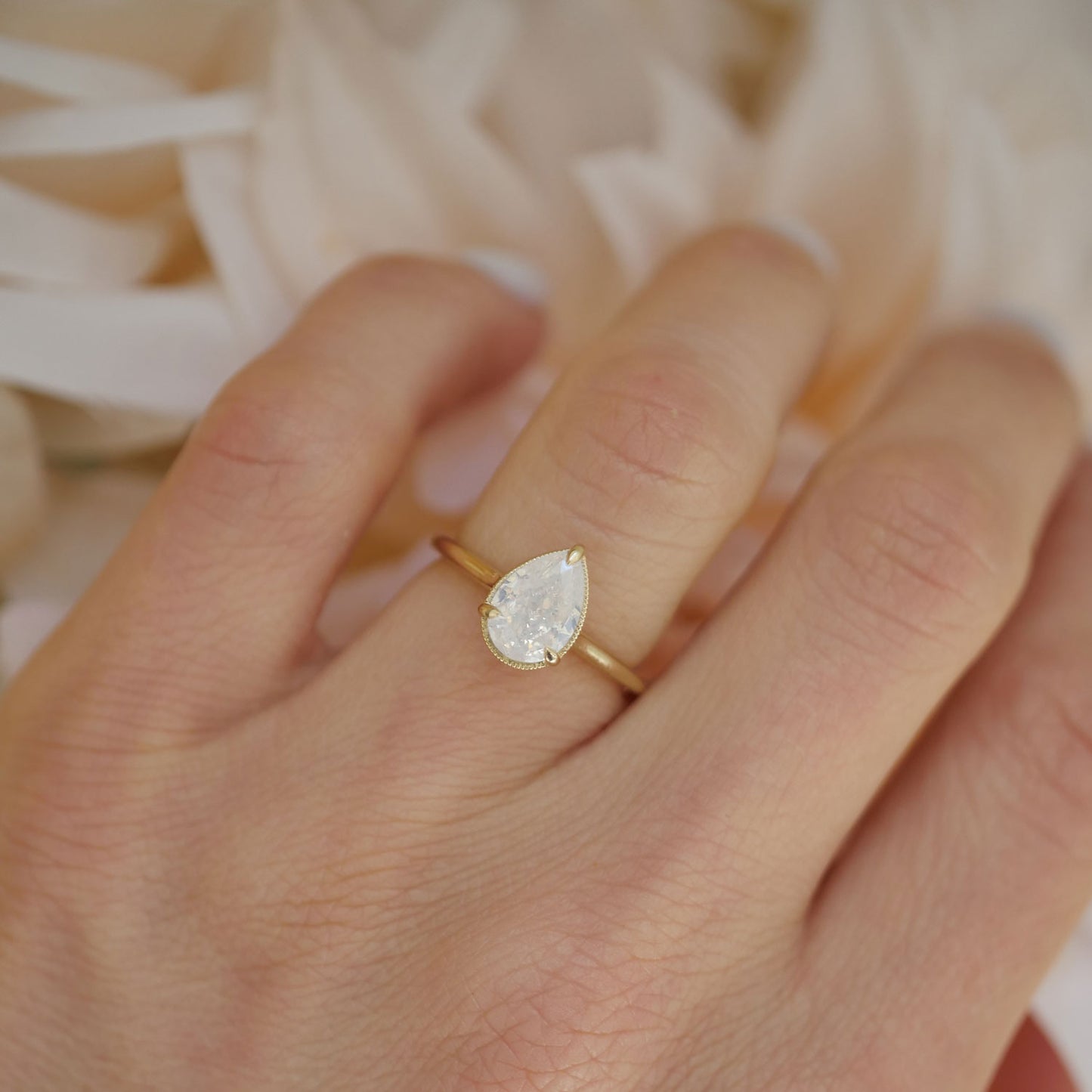 Opalescent Pear Diamond Solitaire Ring