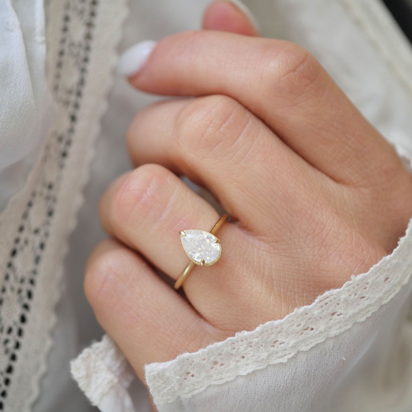 Opalescent Pear Diamond Solitaire Ring