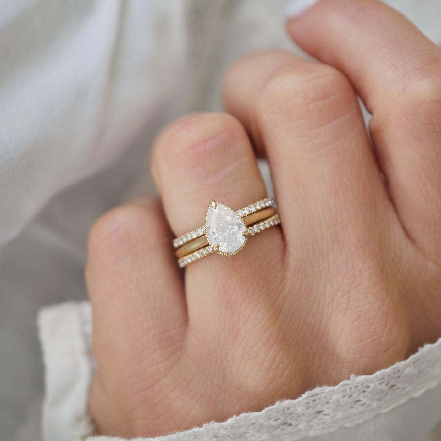 Opalescent Pear Diamond Solitaire Ring