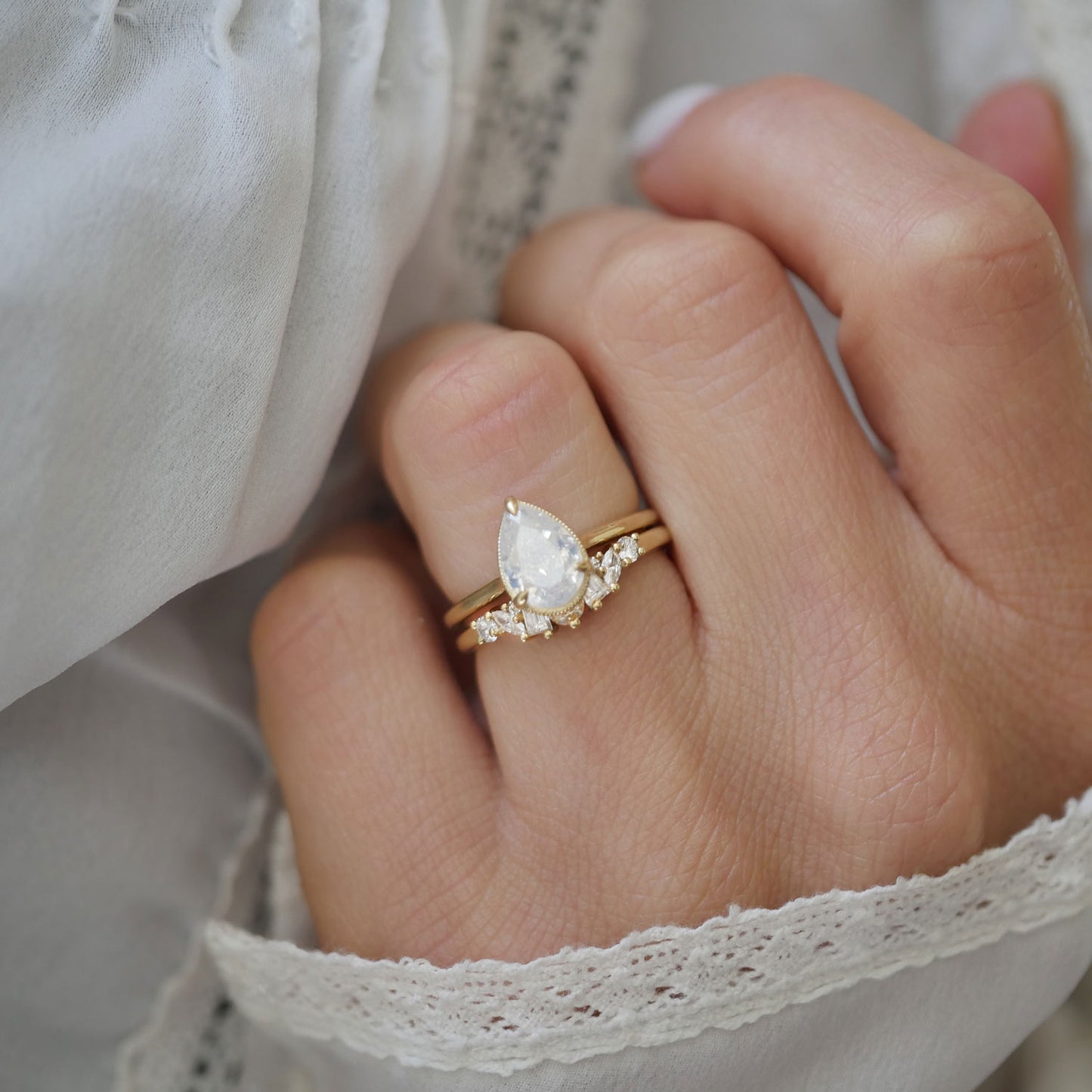 Opalescent Pear Diamond Solitaire Ring