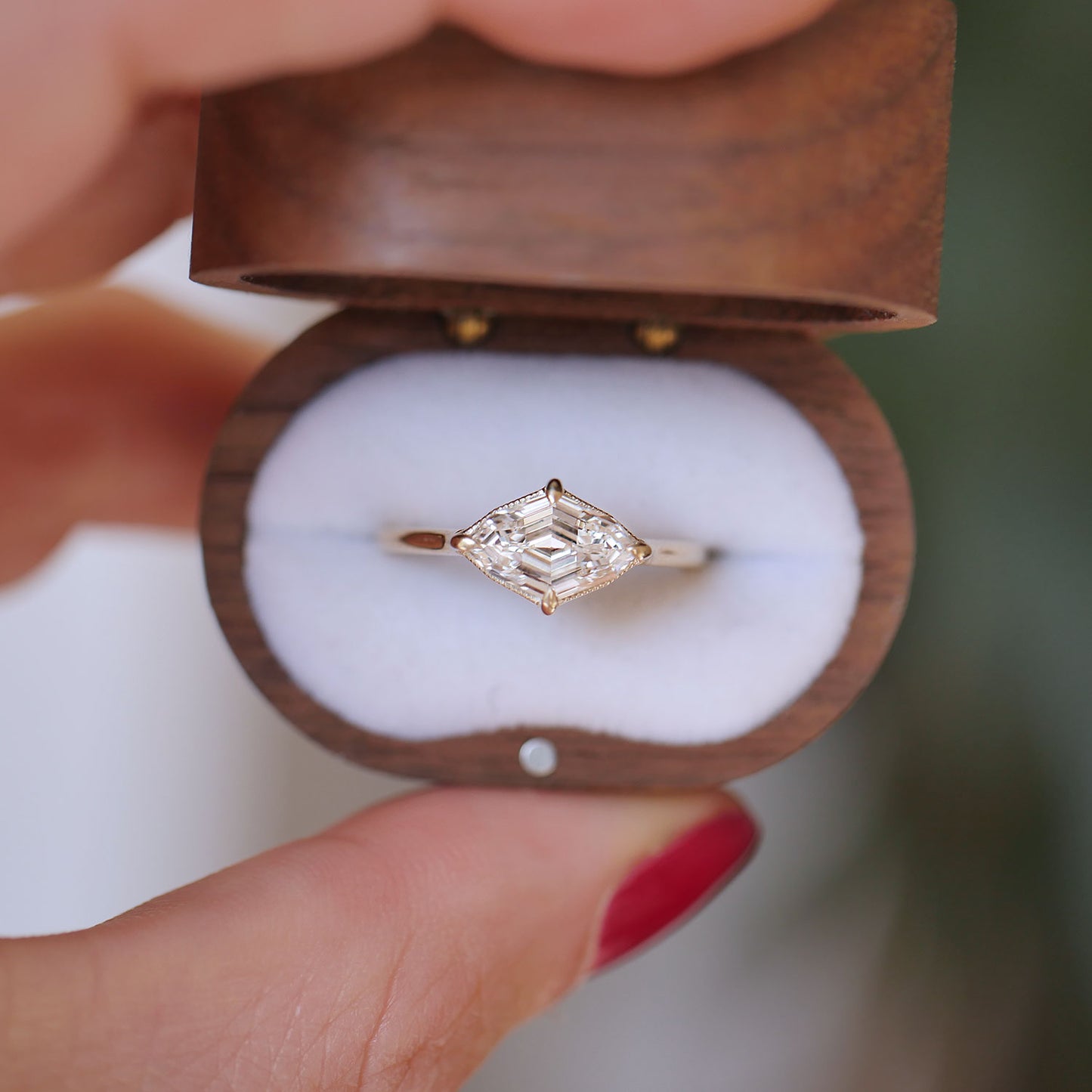 Featuring a radiant natural lozenge cut diamond, this engagement ring is beautiful and creates a refined and timeless look.