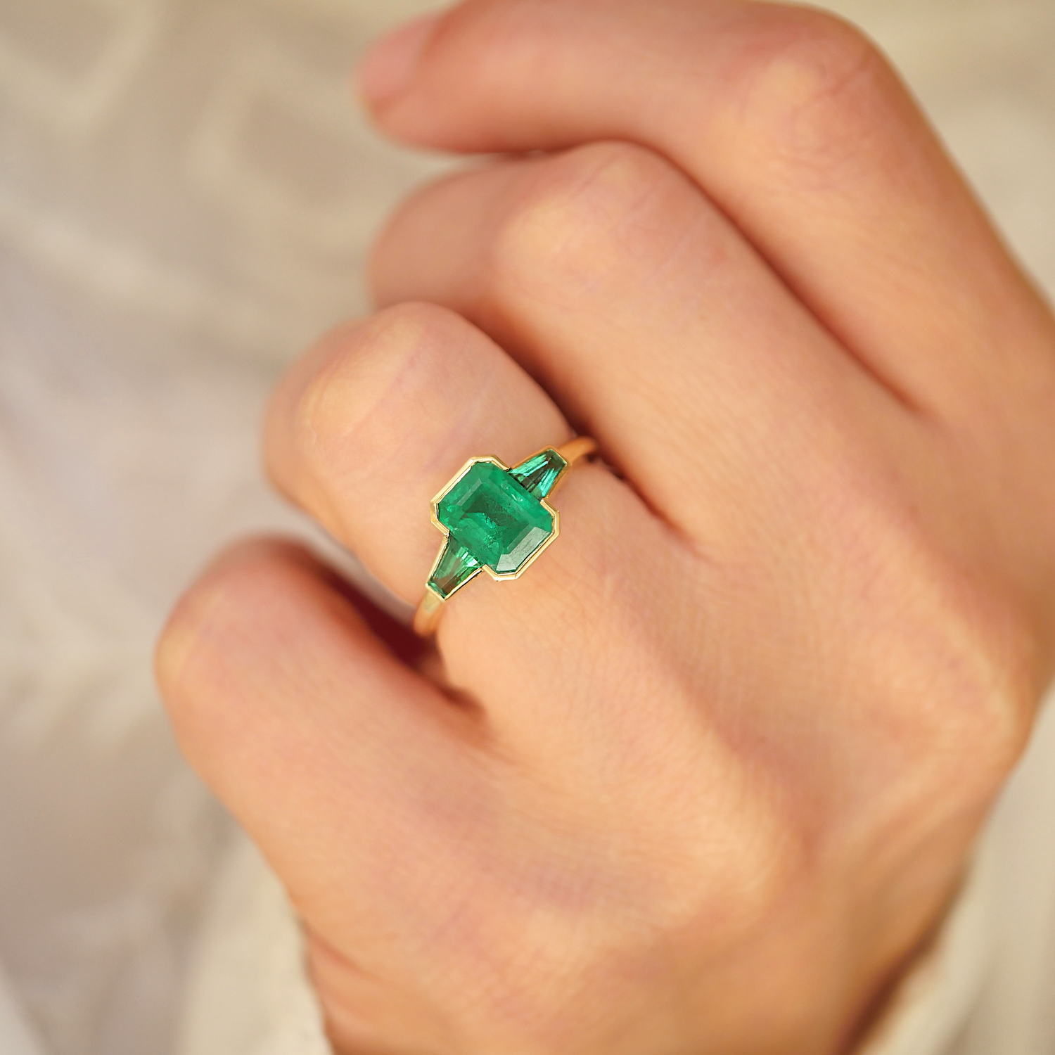Emerald Bezel Trio Engagement Ring