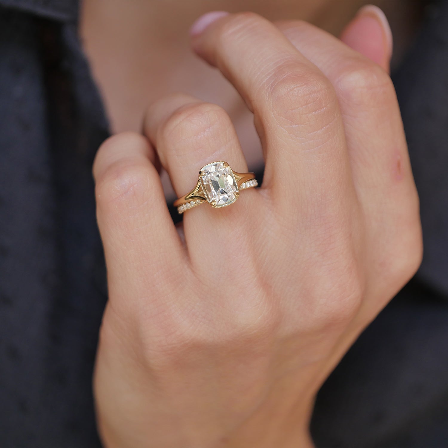 This split shank solitaire ring highlights the elegance of the cushion cut diamond, offering a perfect balance of vintage charm and modern sophistication.