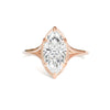 Rose gold band cut diamond split shank solitaire ring.