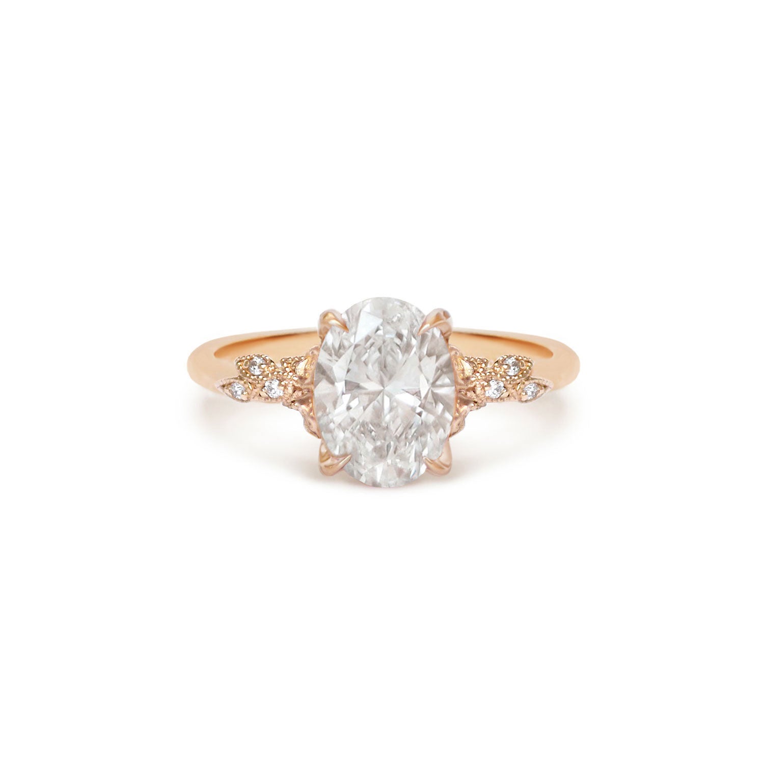 Rose gold ring with a large diamond and smaller diamonds on the band.