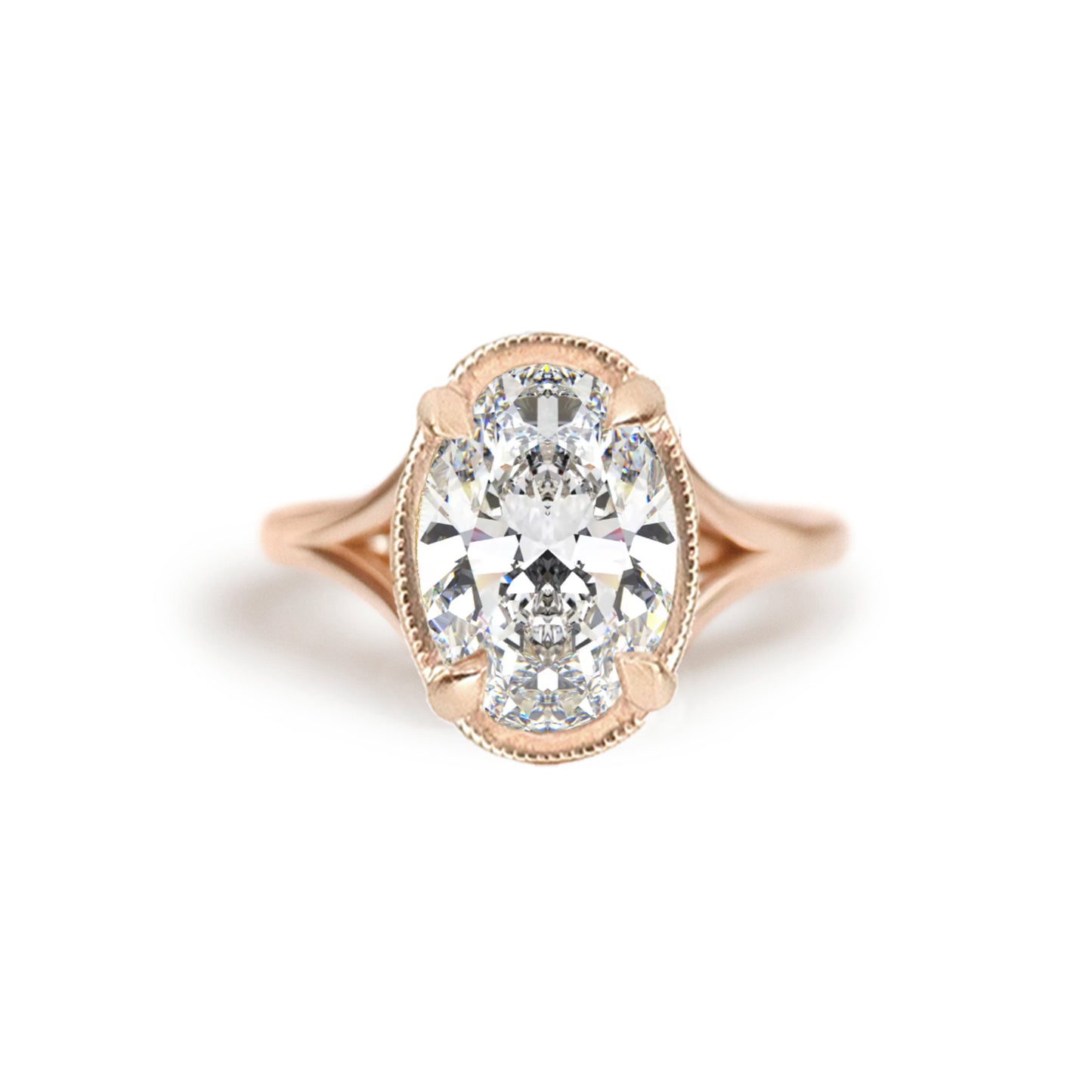 A breathtaking split shank engagement ring featuring oval brilliant cut diamond creating a stunning, elegant ring. Set in 14k rose gold