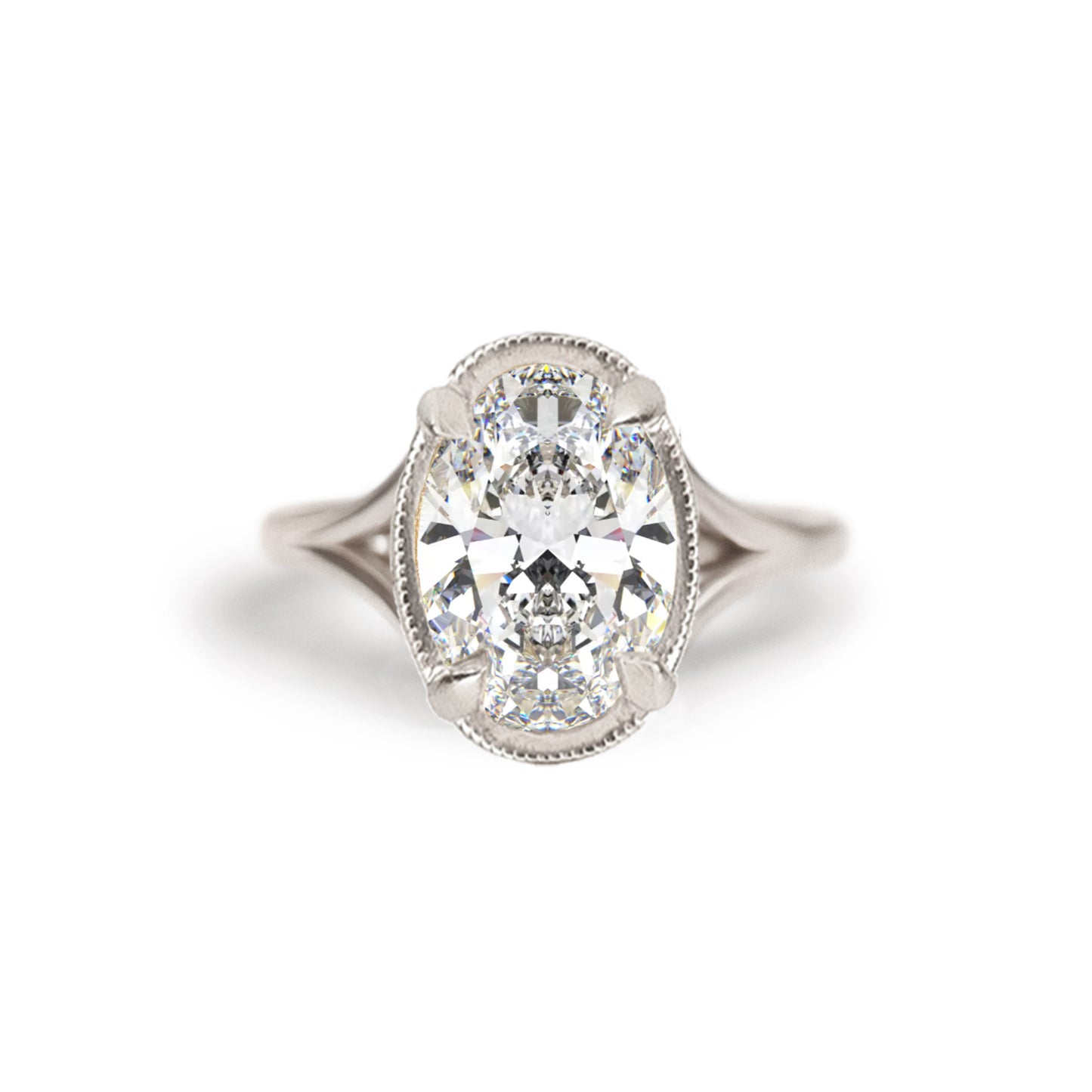 A breathtaking split shank engagement ring featuring oval brilliant cut diamond creating a stunning, elegant ring. Set in 14k white gold