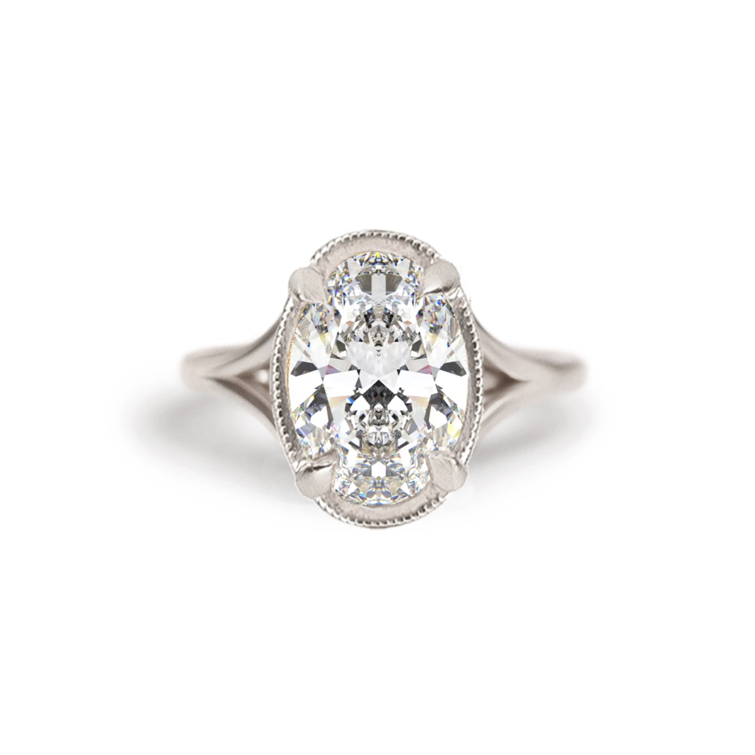 A breathtaking split shank engagement ring featuring oval brilliant cut diamond creating a stunning, elegant ring. Set in 14k white gold