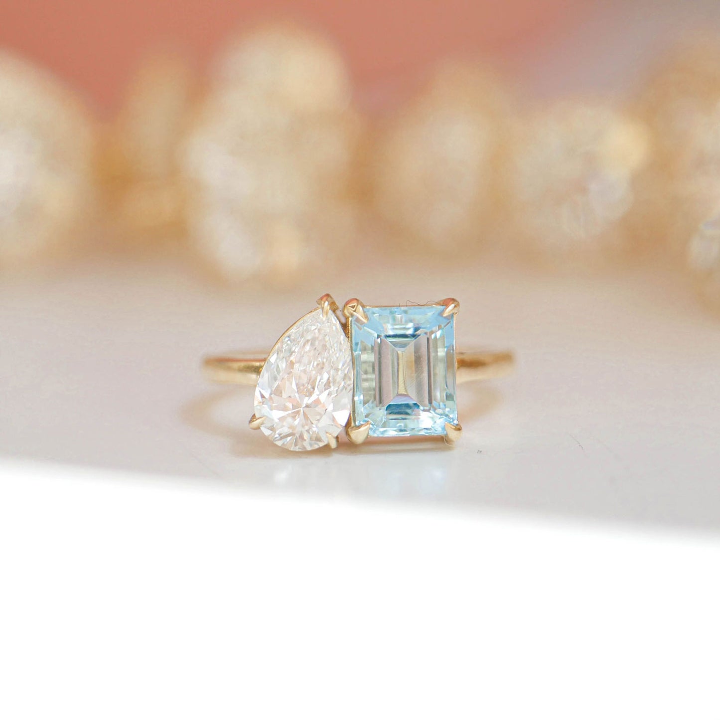 The Aquamarine & Pear Diamond Toi et Moi Ring is a breathtaking fusion of vibrant aquamarine and a dazzling pear diamond, making it a perfect symbol of eternal love and partnership.