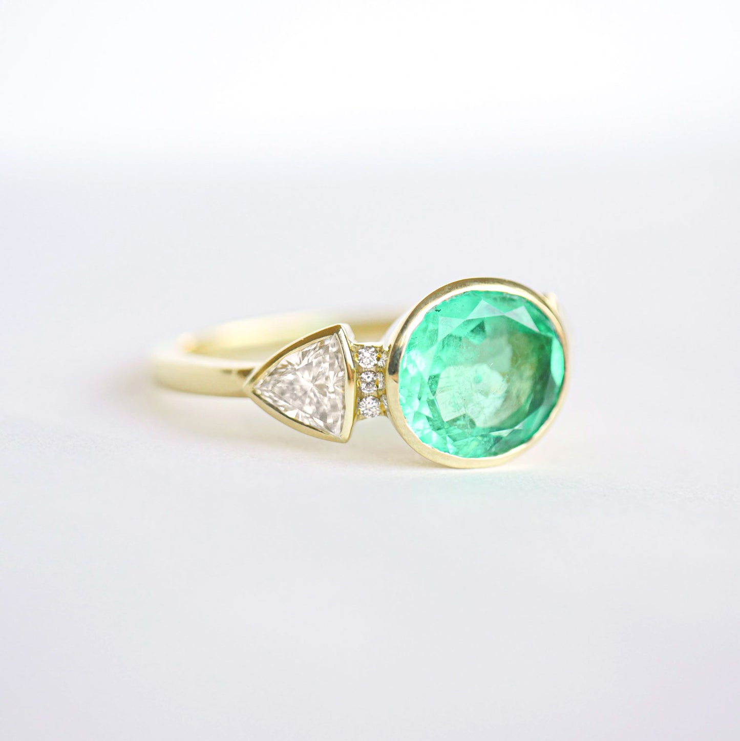 2.43 Carat Oval Colombian Emerald & Trillion Diamond Ring