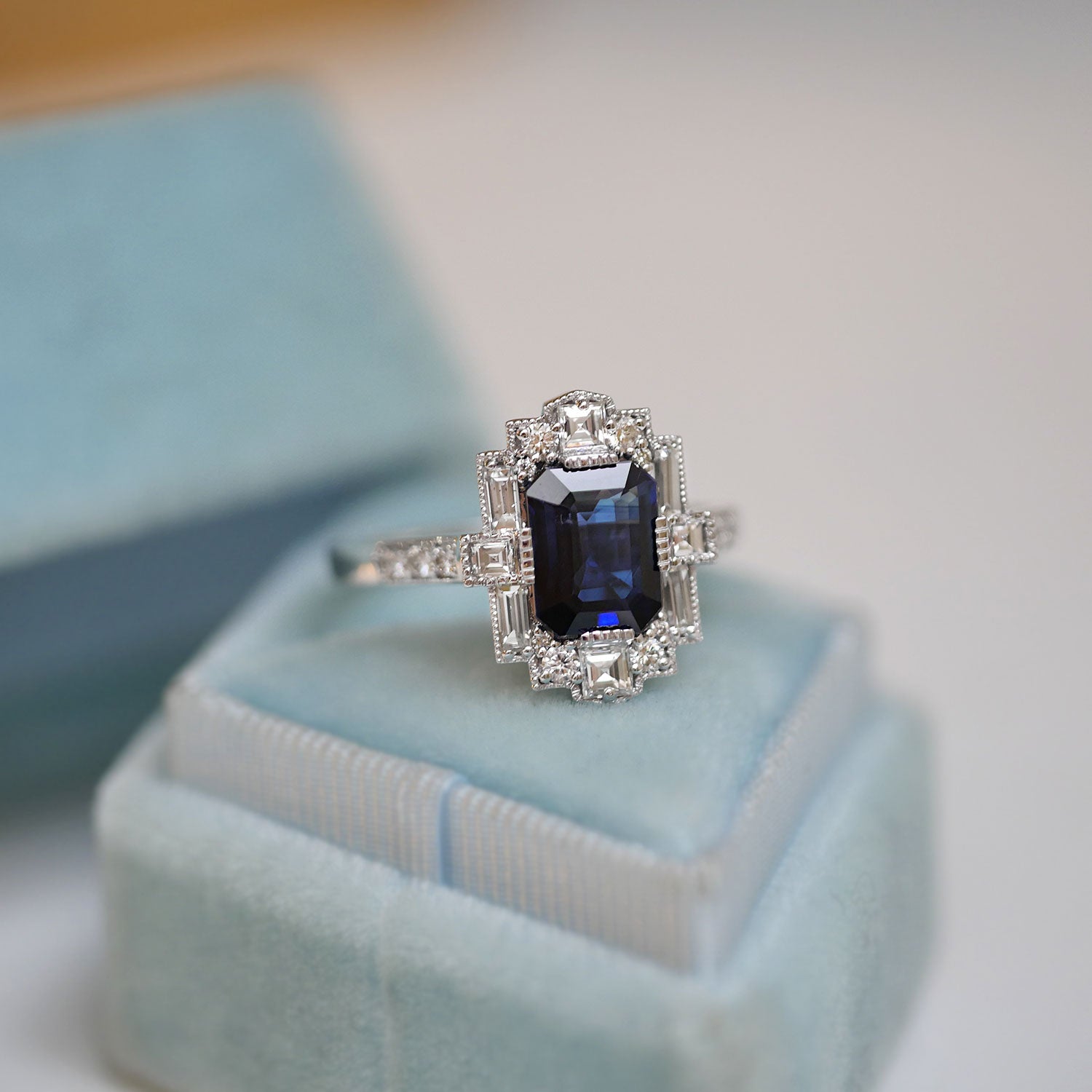Dark Blue Emerald Cut Sapphire Deco Halo Engagement Ring