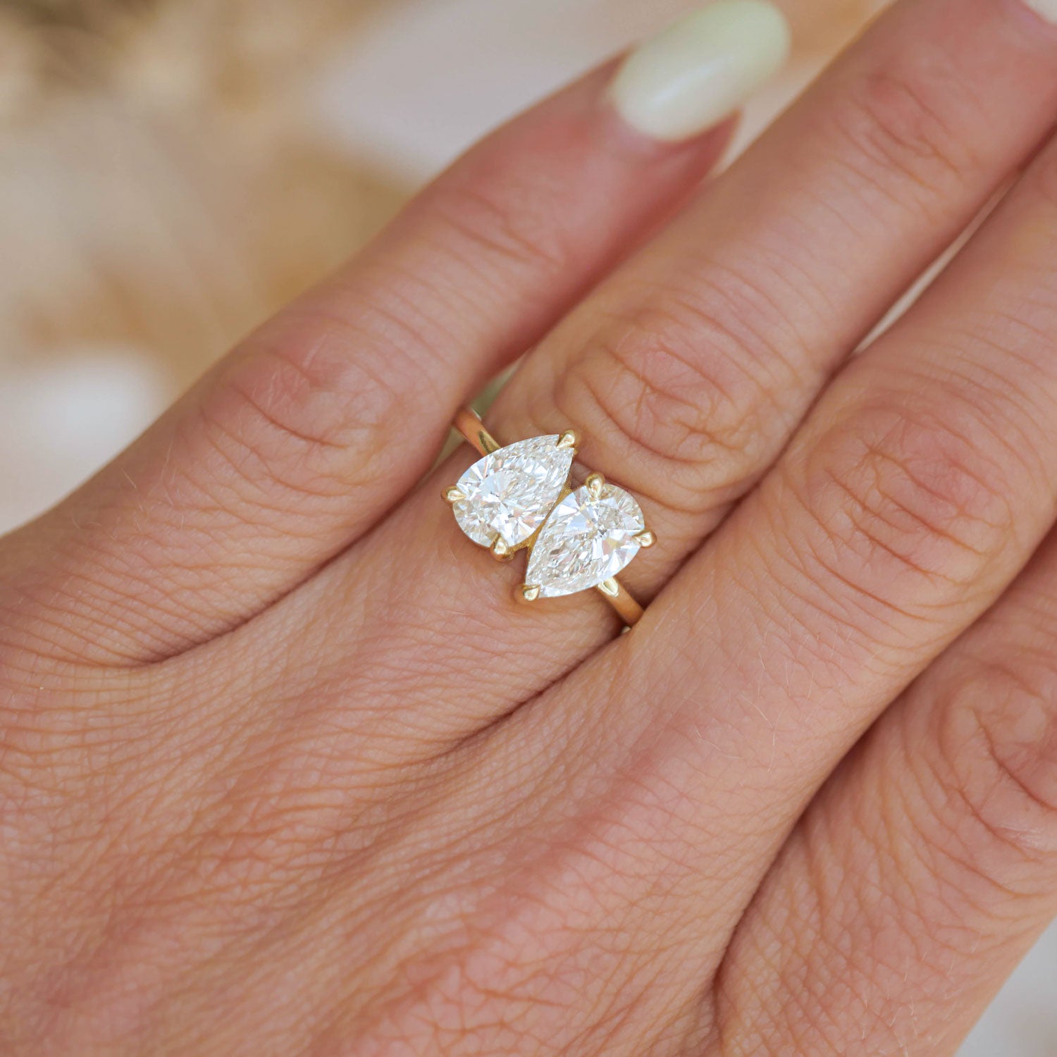 With its elegant design, this two pear diamond toi et moi ring captures the essence of love, offering a timeless and romantic expression of unity.
