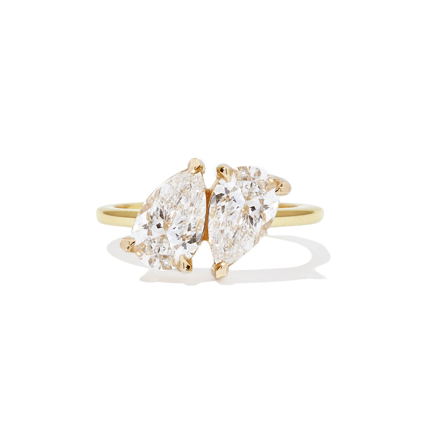 This ring beautifully showcases two pear-shaped diamonds, each representing the unique yet interconnected bond between two individuals in love.